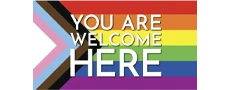 Colorful “You Are Welcome Here” badge with rainbow and progress flag elements, symbolizing inclusivity.