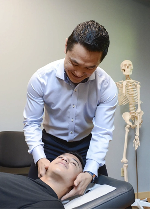 Hands-on chiropractic neck adjustment performed in a clinical setting, emphasizing comfort, safety, and spinal alignment.